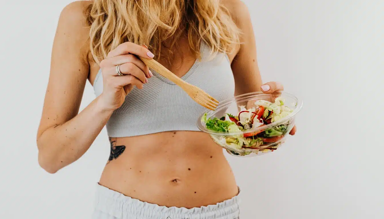 woman holding a bowl of vegetables